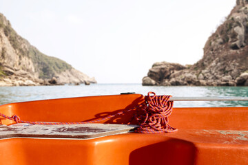 Summer boat of orange color and free space for your decoration. 
