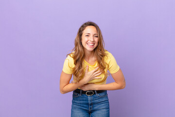 pretty woman laughing out loud at some hilarious joke