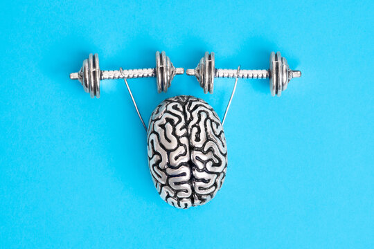 Steel copy of the human brain lifting dumbbells isolated on blue