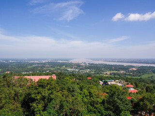 Fototapeta na wymiar Amazing bird's-eye view mountain scenery of summer, blue sky, town near .Mekong River in Thailand.