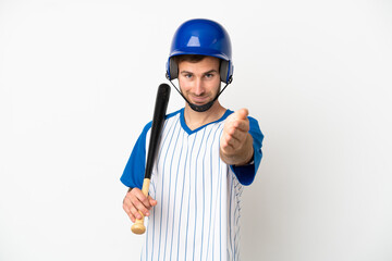 Young caucasian man playing baseball isolated on white background shaking hands for closing a good deal