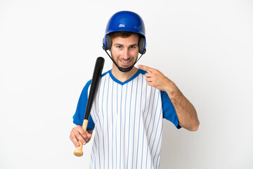 Young caucasian man playing baseball isolated on white background giving a thumbs up gesture