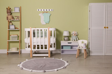 Baby room interior with stylish wooden furniture