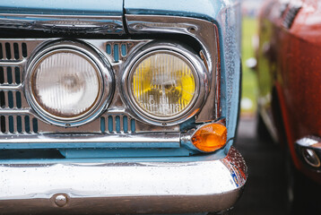 Front lights of a blue retro car. Old Soviet Union classic car