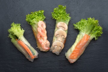 spring rolls isolated on black background