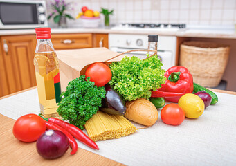 Vegetables on the kitchen table. Healthy food products on the table in the kitchen.