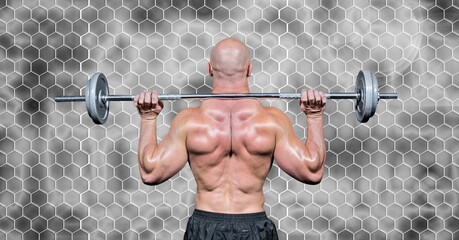 Composition of rear view of muscular man lifting weights with hexagons on grey background