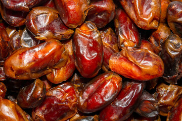 Dried dates background top view.Background of ripe dried dates.