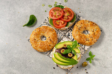 Fresh healthy sandwiches with seeded bagel, slad  and cotage cheese