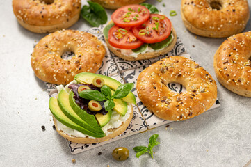 Fresh healthy sandwiches with seeded bagel, slad  and cotage cheese
