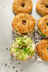 Fresh healthy sandwiches with seeded bagel, slad  and cotage cheese