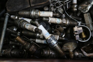 Kuwait City – Kuwait – April 15, 2021: Used and discarded auto spark plugs