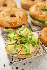 Fresh healthy sandwiches with seeded bagel, slad  and cotage cheese
