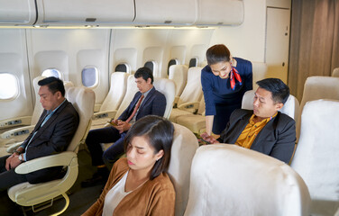 Airways service with air hostess help passenger in travel flight