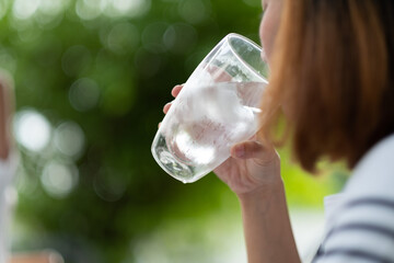 closeup hand drinking fresh water, healthcare concept