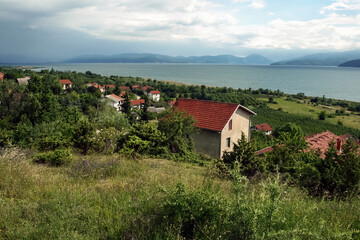 Panorama of Prespa lake, in the southern of the Republic of Northern Macedonia, in an early spring morning, with moutains in background. Prespansko ezero is a major attraction...