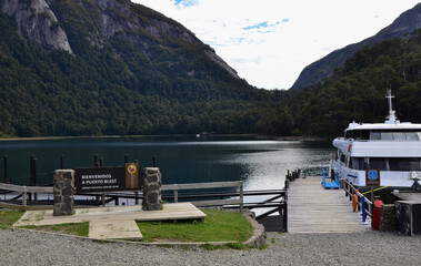 welcome sign to puerto blest, patagonia. lake and ride