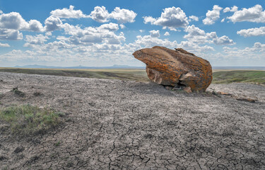 One large concretion boulder on the horizon at Red Rock Coulee natural area near Seven Persons, Alberta, Canada