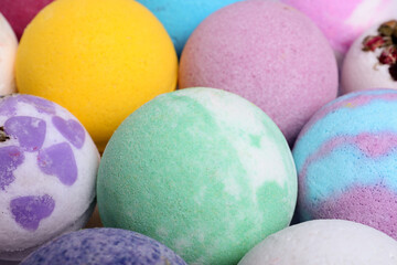Colorful bath bombs as background, closeup view