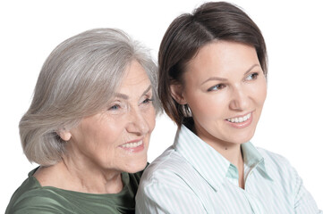 close up portrait of mother and her adult daughter hugging isolated on white