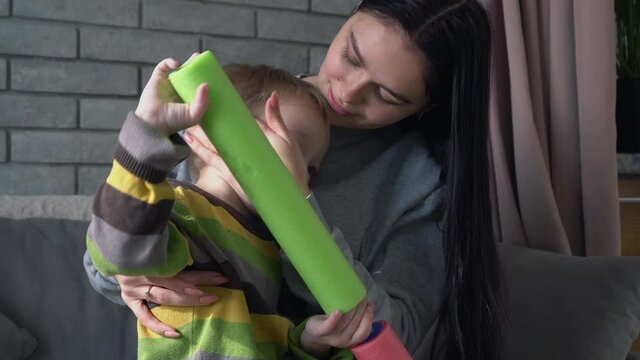 Mother comforts her young son