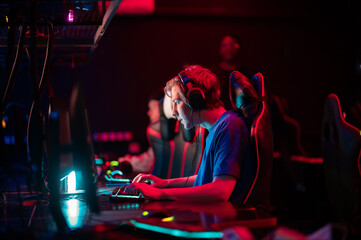 Professional esports players at an online game tournament. The cyber team plays computers and trains