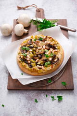 Pizza with rosemary bean cream champignon mushrooms leeks and hazelnuts (ph. Marianna Franchi)