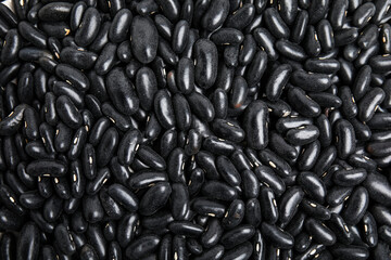 Heap of black beans as background, top view. Veggie seeds