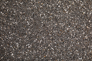 Heap of chia seeds as background, top view. Veggie food