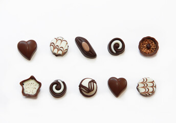 sweet chocolate candies with filling on a white background