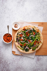Pizza with turnip greens red onions pine nuts and dried tomato pesto (ph. Marianna Franchi)