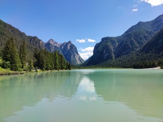Obraz premium lake in the mountains, lake Dobbiaco, The Dolomites, Alto Adige, Italy