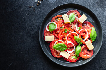 tomato salad veggie vegetable, cheese, onion diet vitamin on the table healthy food keto or paleo diet meal snack copy space food background rustic. top view vegan or vegetarian food