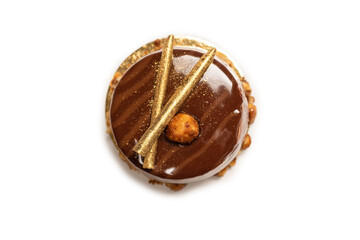 Chocolate and caramel cake isolated on a white background.