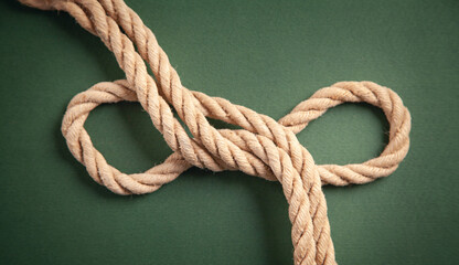 Brown rope on green background.