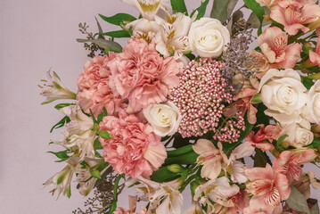 Bouquet of  soft pink flowers in wrapping paper.