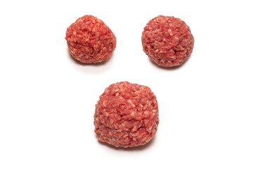 Raw meat balls isolated on white background.