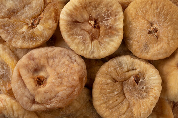 Dried whole sweet figs close up full frame as a background 