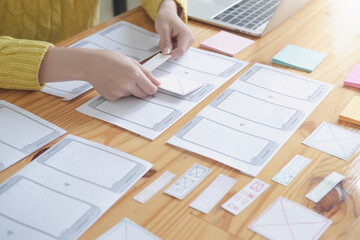 Web designer meeting  planning application for mobile phone. Design Online Technology Content, Ideas Proposal Strategy Tactics Vision Design Concept