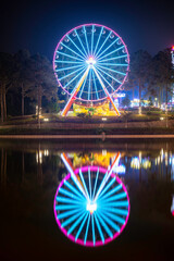 Spinning ferris wheel at night