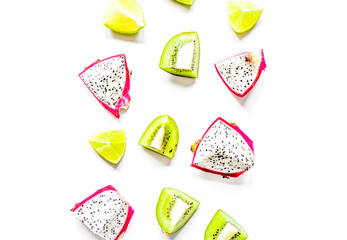 pattern with sliced kiwi and pitaya on white background top view mockup