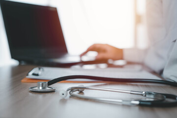 Specialized doctors are working with laptop to print patient information or are analyzing the cause of pathogens, Concept of medical treatment Health care, public health, prevention of virus.