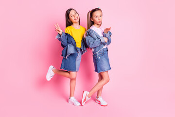 Fototapeta premium Full size photo of optimistic brunette blond girls blow kiss wear yellow pink t-shirt isolated on pink background