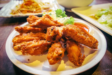 fried chicken wings on white plate