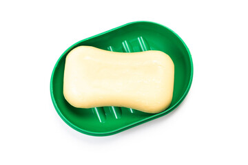 Travel soap in plastic soap dish isolated on white background