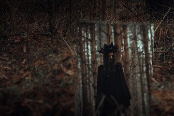 reflection of a dark frightening witch in a mirror
