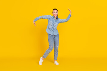 Fototapeta na wymiar Full length body size photo cheerful careless girl dancing at party relaxing on weekend isolated bright yellow color background