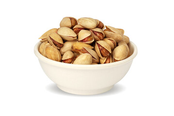 pistachios in a white plate isolated on a white background.