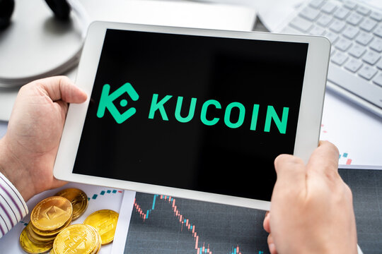 Russia Moscow 05.05.2021. Tablet with logo of cryptocurrency stock exchange Kucoin, China. Crypto coins company, service for buying, selling, trading, investing by market price. Bitcoin, Ethereum