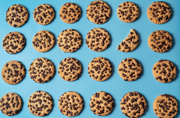 Chocolate sweet cookies background over blue background.